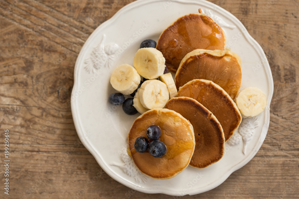 Yummy breakfast. Pancakes with blueberries and banana. Yummy breakfast. Pancakes with blueberries and banana.