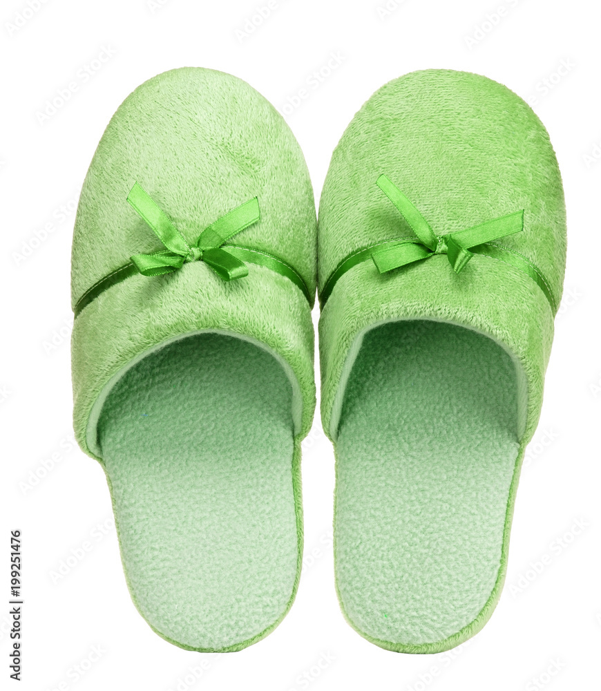Green home slippers with ribbon isolated on white background. Close up, high resolution Green home slippers with ribbon isolated on white background. Close up, high resolution