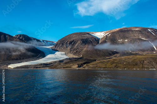 Classic sea s glacier in Canada. Best view of water  ice and rocks.