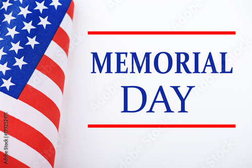 Background of United States flag on white background next to text about memorial day celebration.