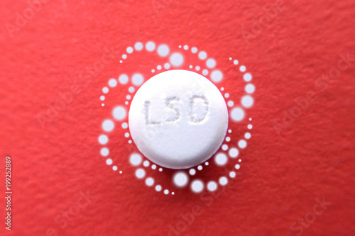 Tablet LSD on red pattern light psychedelic