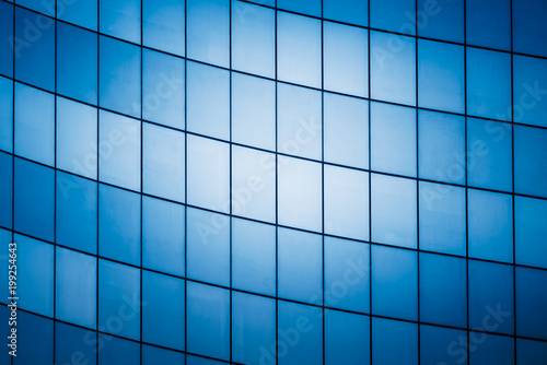 full frame of modern glass building,blue toned.