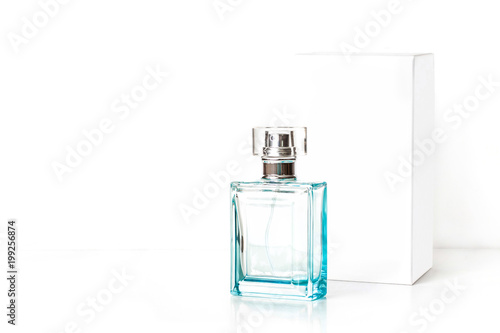 Perfume bottle, light blue glass fragrance spray and white packaging box mock up