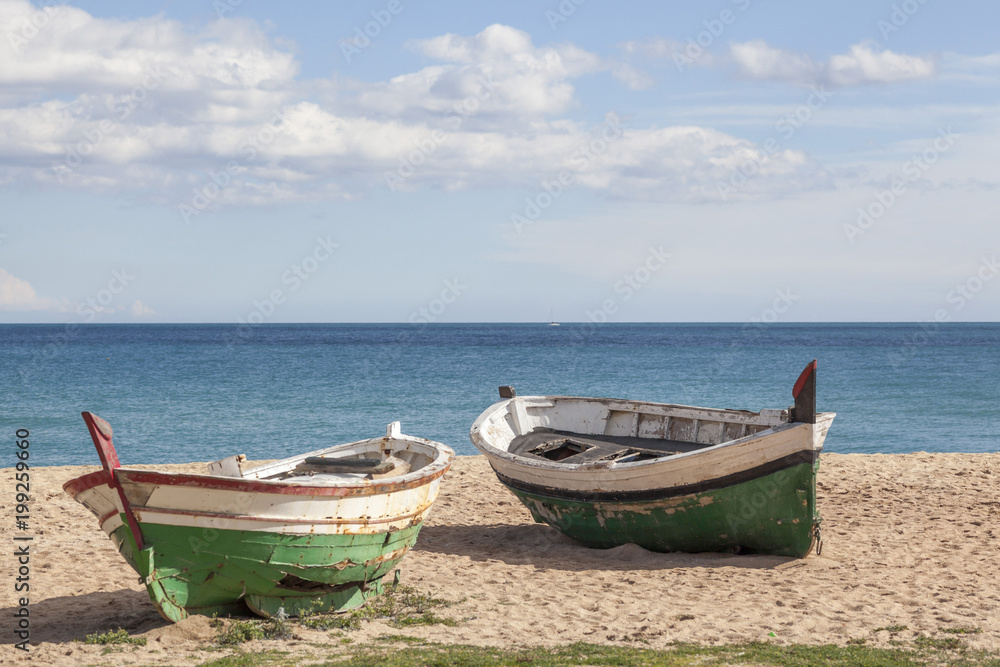 Mediterranean beach and two fishing boats. Mediterranean beach and two fishing boats.