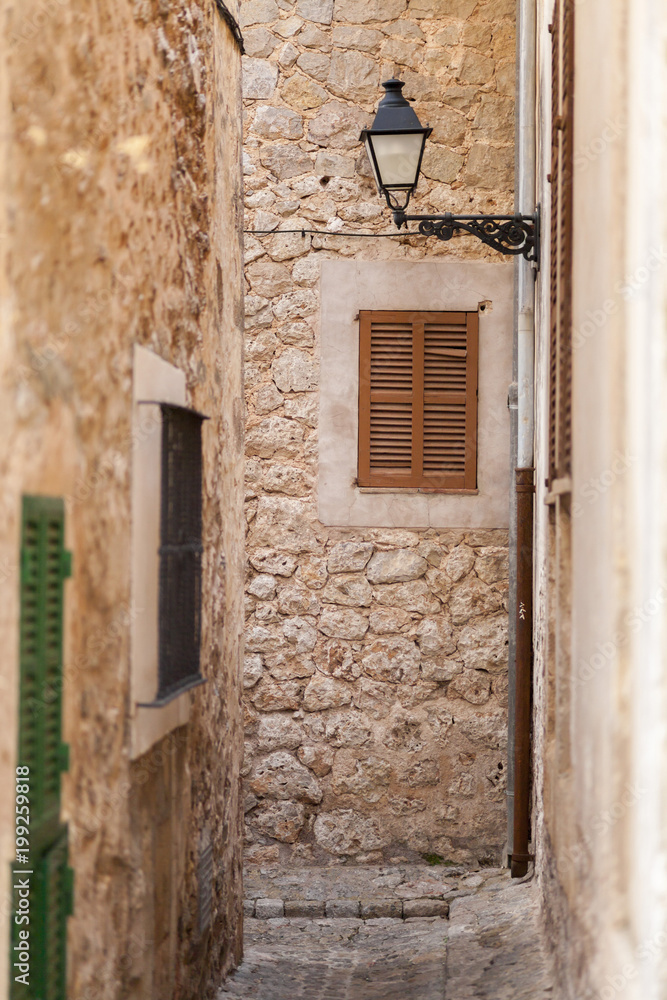 Narrow street in village of Valldemossa, Majorca island, Spain.