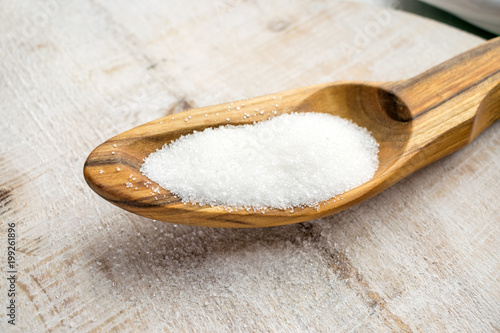 Artificial Sweeteners and Sugar Substitutes in wooden spoon. Natural and synthetic sugarfree food additive:  sorbitol, fructose, honey, Sucralose, Aspartame