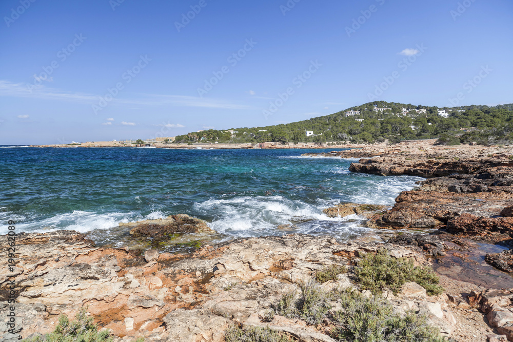 Obraz premium Mediterranean sea, coastal view, rock formation, town of Sant Antoni, Ibiza Island,Spain.