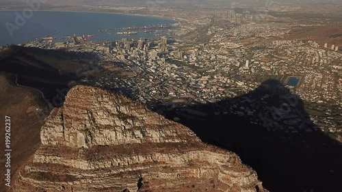 Flying past Lion's Head with city of Cape Town