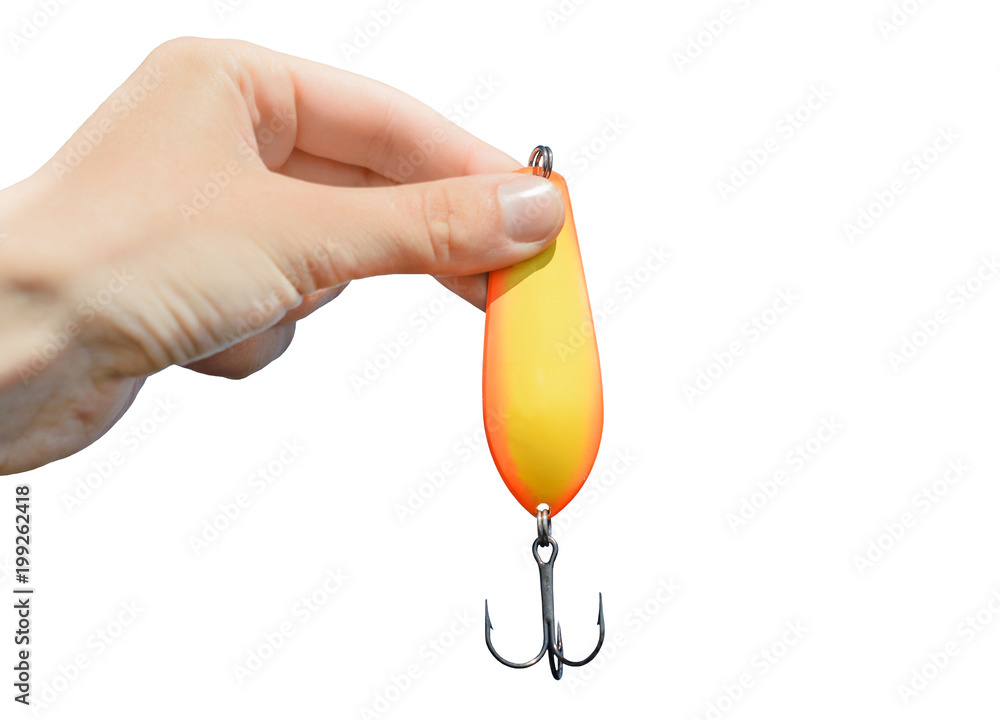 The metal fishing tackle with hook is in a hand isolated on white  background. It is