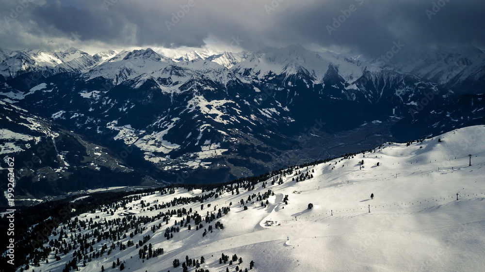 Aerial view from drone on Austrian Alps. Scenic panorama opens and beautiful clouds on background.