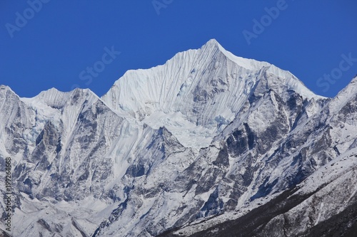 Snow covered mountain Gangchenpo in spring. Langtang valley, Nepal.