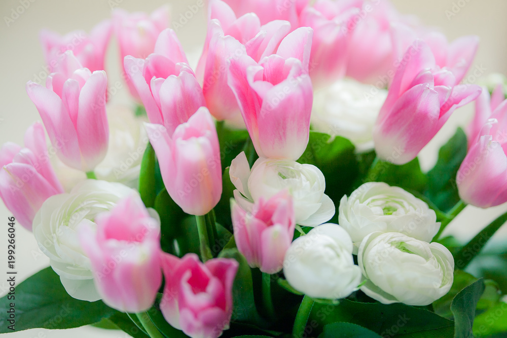bouquet of pink tulips and white Ranunculus