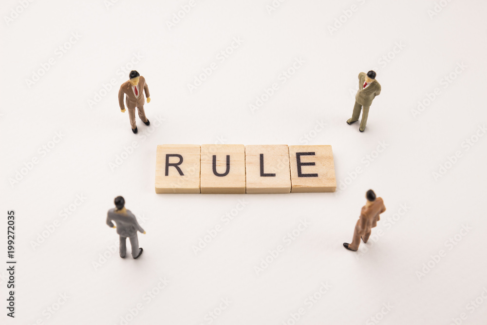 businessman figures meeting on rule conceptual businessman figures meeting on rule conceptual