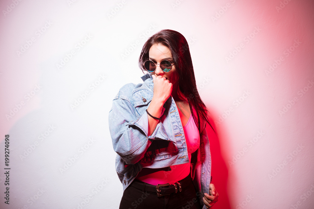 Pretty casual woman pink top in sunglasses Pretty casual woman pink top in sunglasses
