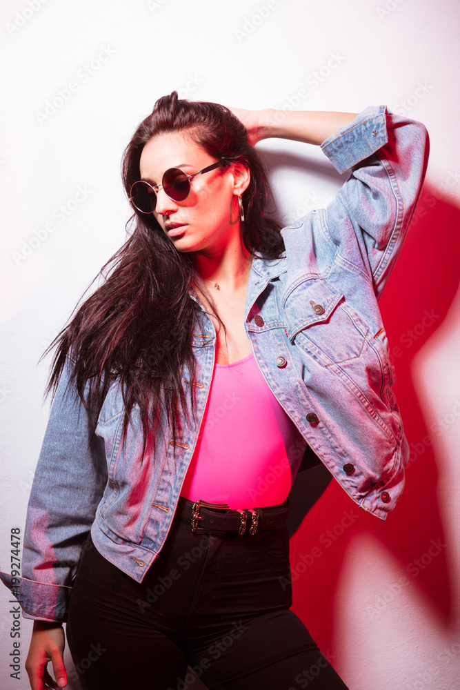 Pretty casual woman pink top in sunglasses Pretty casual woman pink top in sunglasses