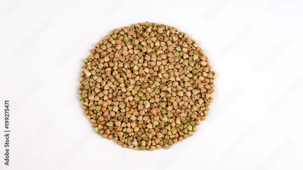 Circle shaped heap of raw buckwheat rotating. View from above/overhead. Isolated on white. Loopable. Close up macro. Circle shaped heap of raw buckwheat rotating. View from above/overhead. Isolated on white. Loopable. Close up macro.