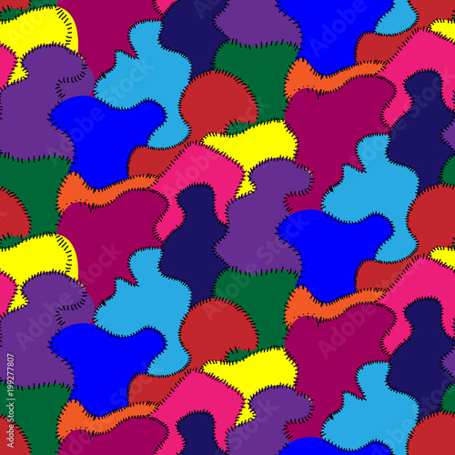 Seamless repeating pattern from different pieces of fabric and sewn with threads