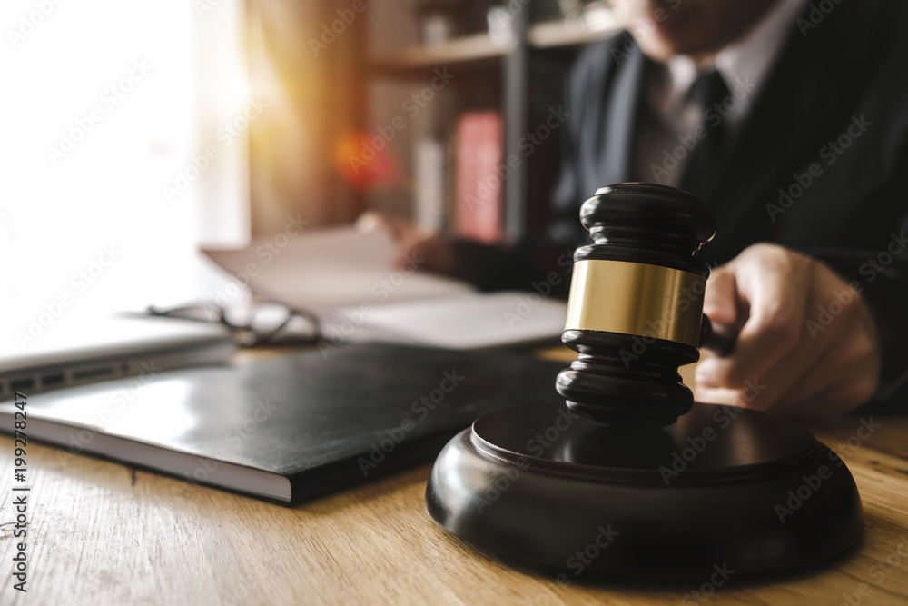 Justice and law concept.Male judge in a courtroom with the gavel,working with,digital tablet computer docking keyboard,eyeglasses,on wood table
Justice and law concept.Male judge in a courtroom with the gavel,working with,digital tablet computer docking keyboard,eyeglasses,on wood table