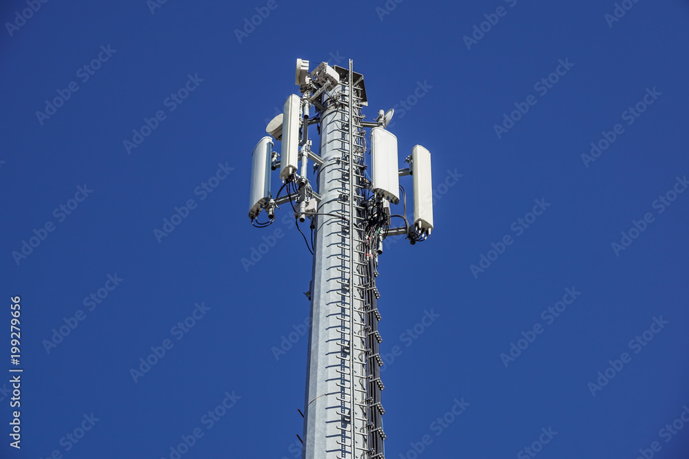 Technology on the top of the telecommunication GSM 4G tower antenna, transmitter , blue sky, white clouds. Technology on the top of the telecommunication GSM 4G tower antenna, transmitter , blue sky, white clouds.