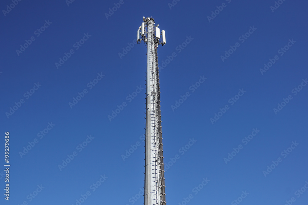 Technology on the top of the telecommunication GSM 4G tower antenna, transmitter , blue sky, white clouds. Technology on the top of the telecommunication GSM 4G tower antenna, transmitter , blue sky, white clouds.