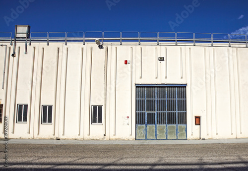 Wallpaper Mural Cargo gate of Industrial warehouse. Industrial door. View on the one gates of big warehouse facade. Front view Torontodigital.ca