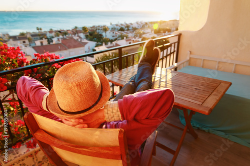 young man relax on scenic balcony terrace photo