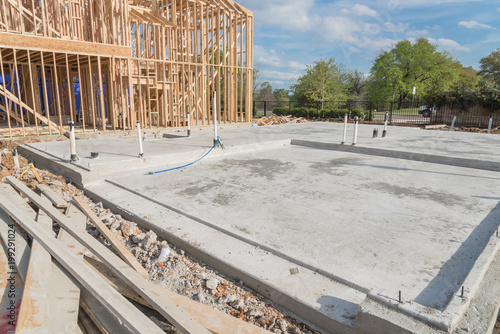 Fotografija Slab-on-grade foundation footing timber frame house under construction in Irving, Texas, USA
