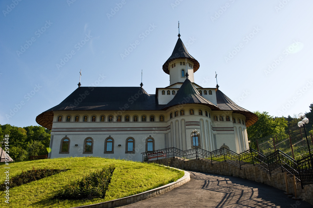 Pangarati orthodox Romanian monastery heritage outdoor architecture in daytime.