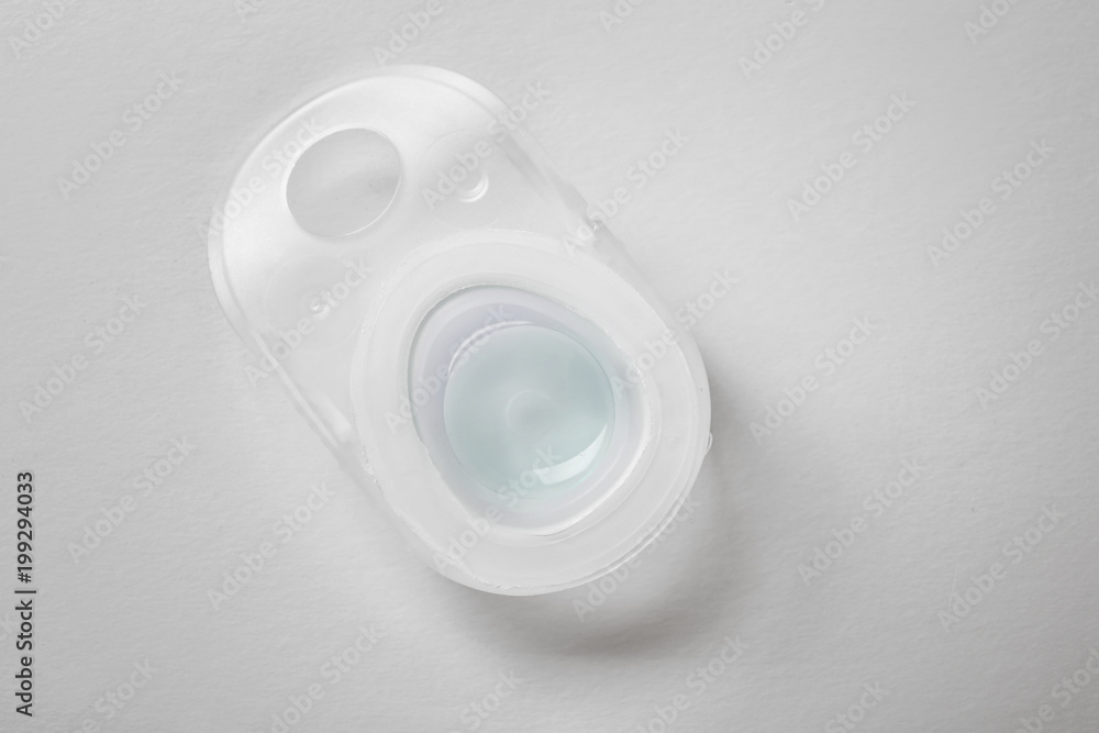 Package with contact lens on white background Package with contact lens on white background