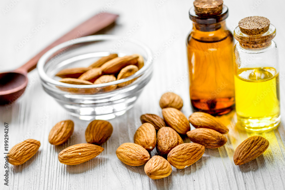 organic cosmetic with almond extract on table background organic cosmetic with almond extract on table background