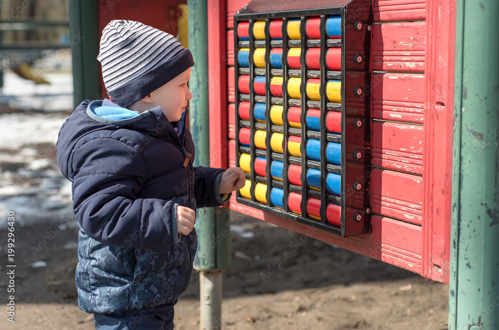 Young boy play in the playground Young boy play in the playground