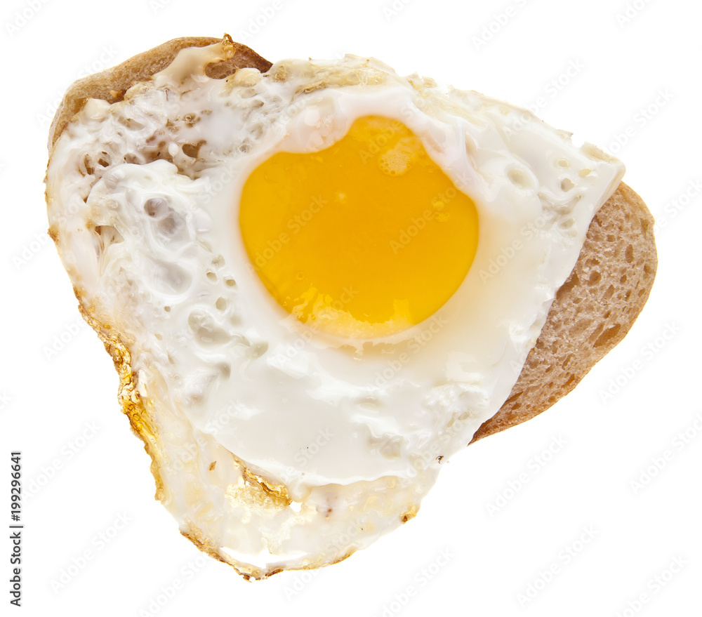 fried eggs in the form of a heart and bread isolated on white background
