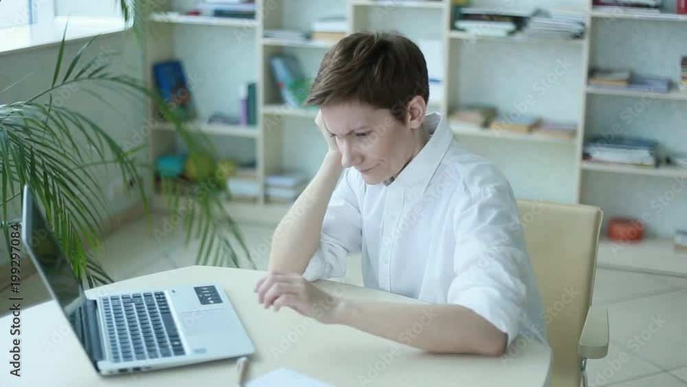 woman office worker holding head headache problems woman office worker holding head headache problems