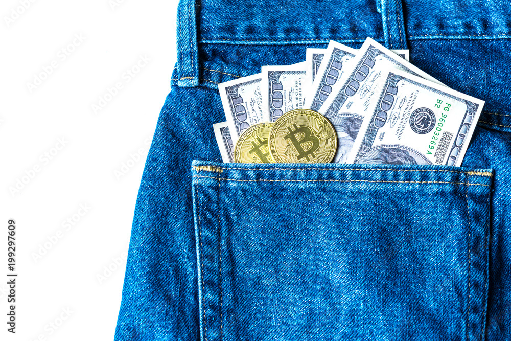 Golden bitcoins and large stack of money in the pocket of old vintage indigo stonewashed jeans. Concept of cryptocurrency and competition with physical money. Modern trendy color Golden bitcoins and large stack of money in the pocket of old vintage indigo stonewashed jeans. Concept of cryptocurrency and competition with physical money. Modern trendy color