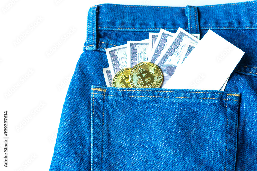 Golden bitcoins and large stack of money in the pocket of old vintage indigo stonewashed jeans. Concept of cryptocurrency and competition with physical money. Modern trendy color Golden bitcoins and large stack of money in the pocket of old vintage indigo stonewashed jeans. Concept of cryptocurrency and competition with physical money. Modern trendy color