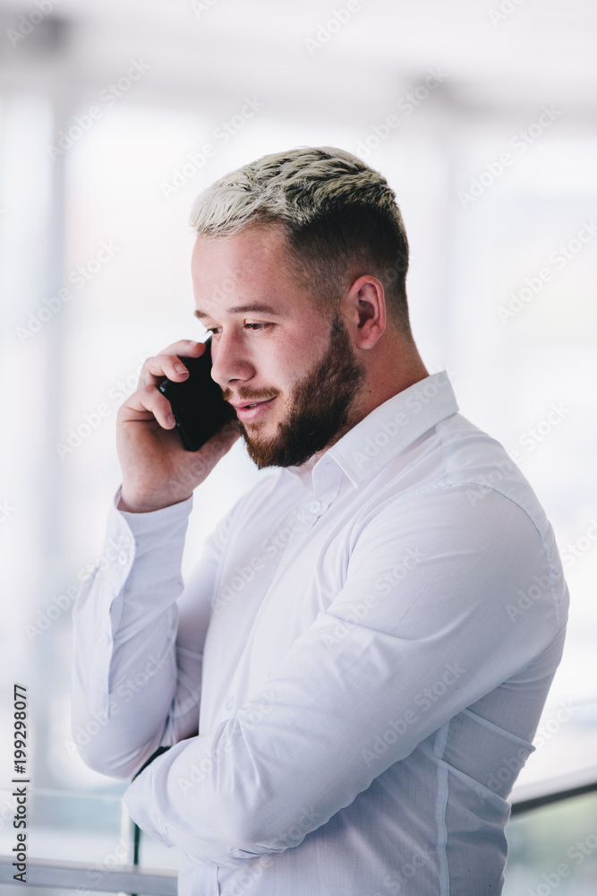 Young Businessman Talking On Phone Young Businessman Talking On Phone