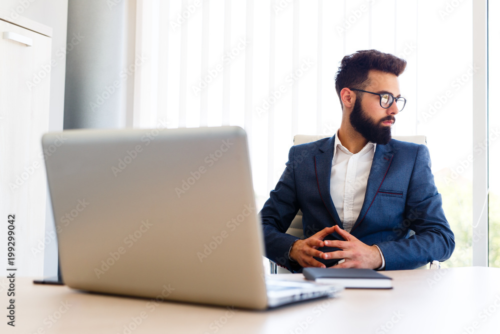 Young Boss Sitting At Office In His Company Young Boss Sitting At Office In His Company
