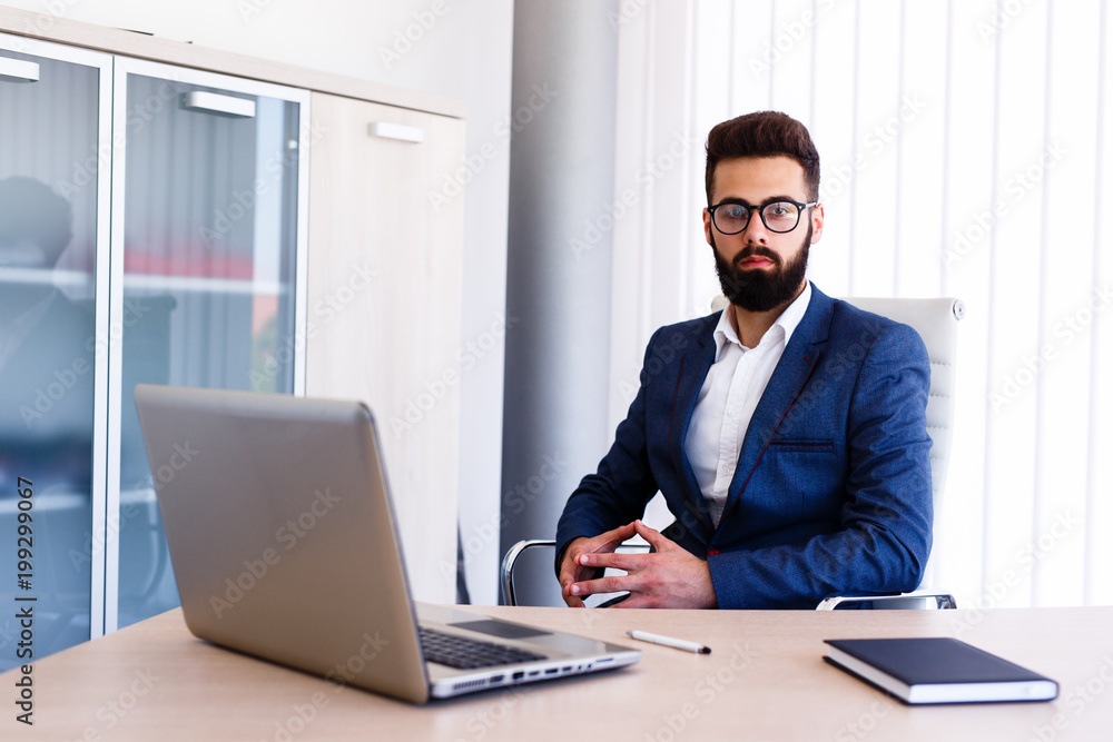 Young Boss Sitting At Office In His Company Young Boss Sitting At Office In His Company