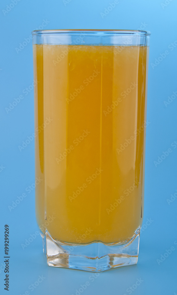 orange juice on a blue background