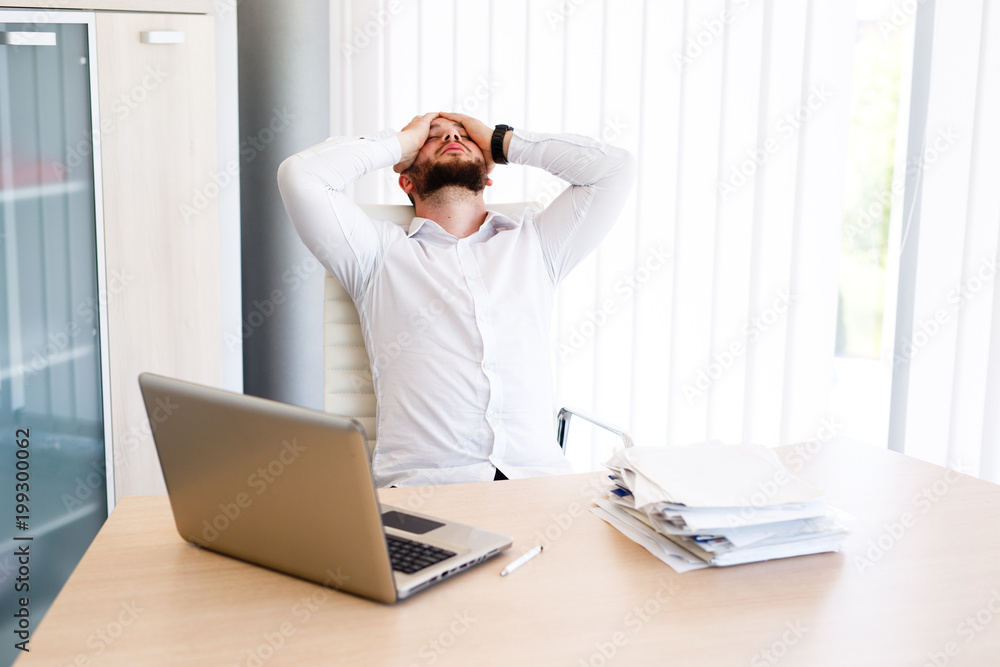 Young Businessman Has Very Stressful Day At Work Young Businessman Has Very Stressful Day At Work