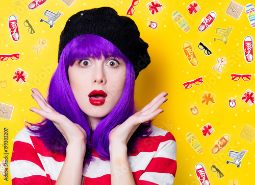 Portrait of a young woman with purple hair on yellow background with ojects