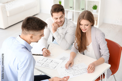 Real estate agent showing p...