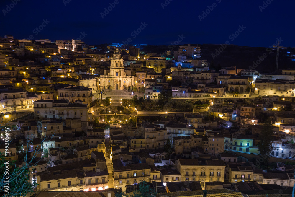 Night view of the illuminated Modica and the imposing San Giorgio cathedral