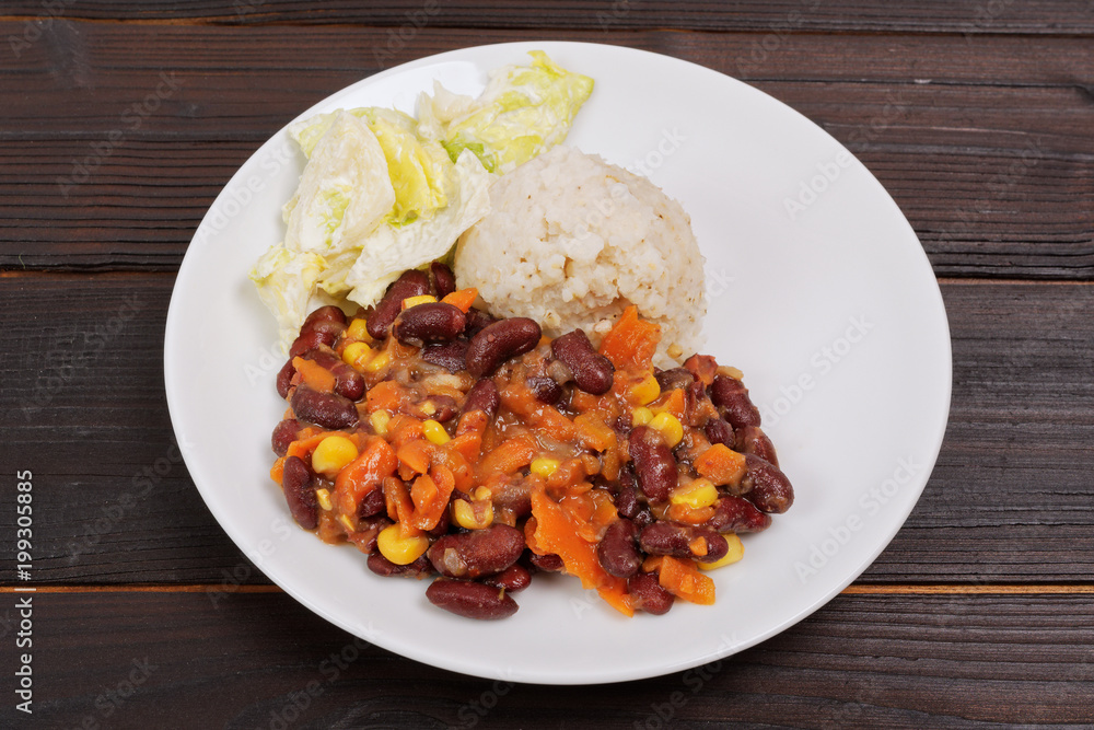Red beans with corn and carrot, sorghum on a table Red beans with corn and carrot, sorghum on a table