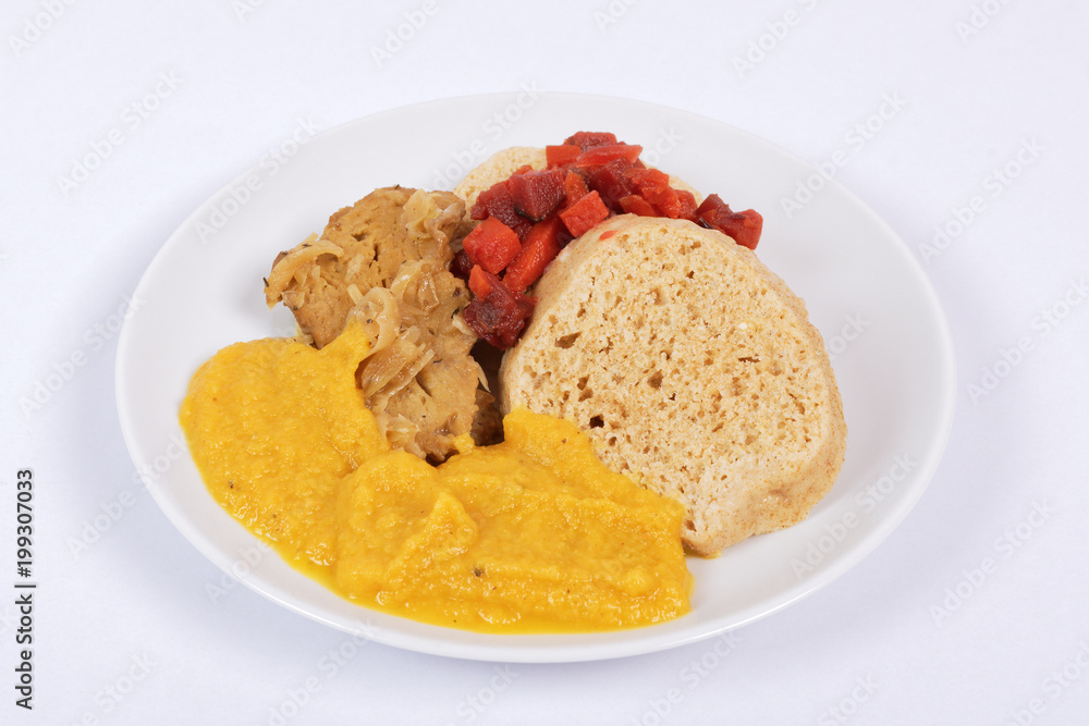 Sauce with seitan and dumplings on a on a white