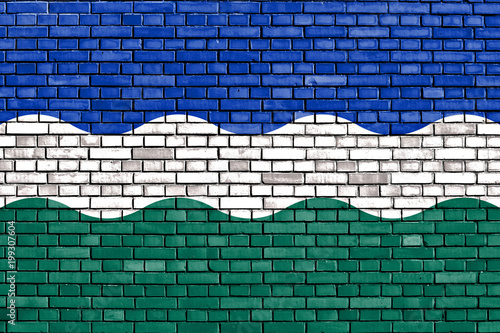 flag of Nederweert painted on brick wall photo