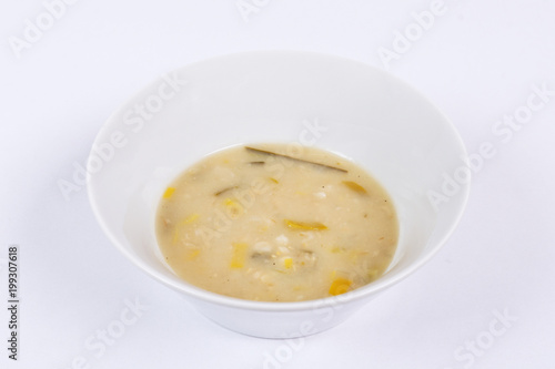 Yeasts soup with vegetables on a white
