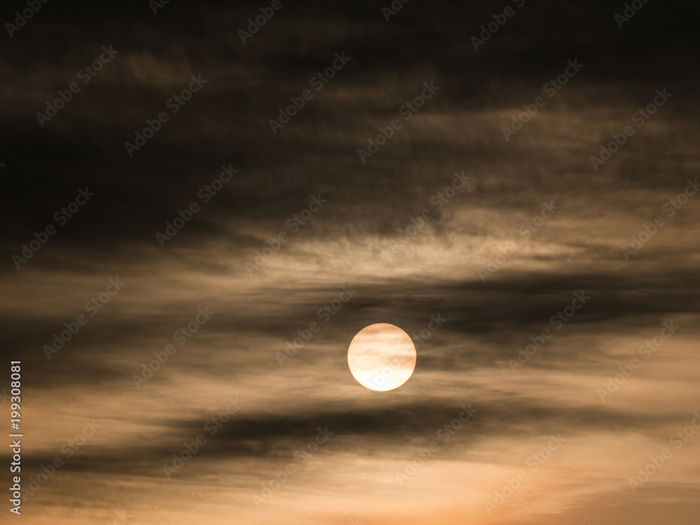 Obraz premium Rising Sun behind The Streaming Clouds