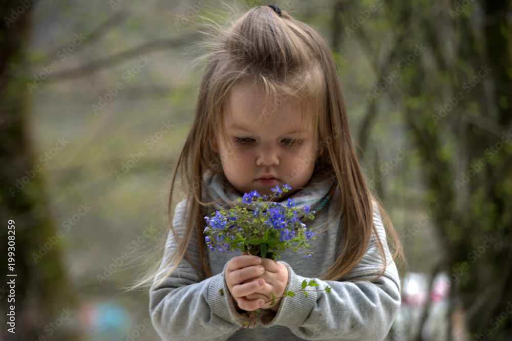 girl holding a bouquet of flowers forget-me-not girl holding a bouquet of flowers forget-me-not