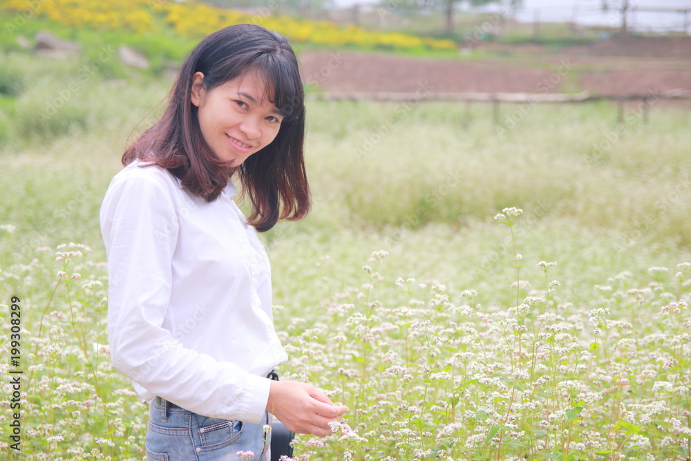 woman at the flower garden in Hanoi, Vietnam woman at the flower garden in Hanoi, Vietnam
